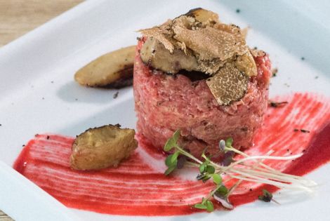 Beef tartare with truffles, goose liver and raspberry